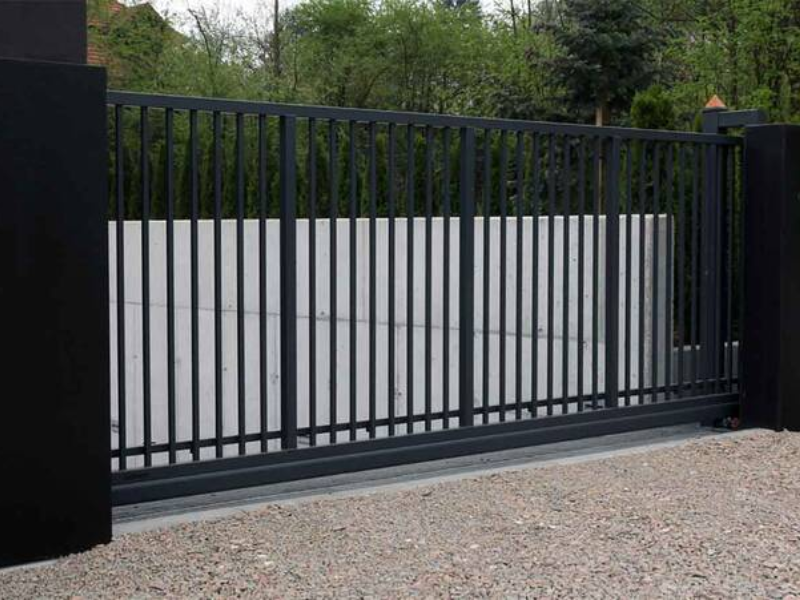 Electric motor and keypad in modern sliding gate access control setup