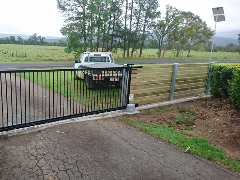 Solar Sliding Gate Automation system with motor and solar panel installed on residential driveway.