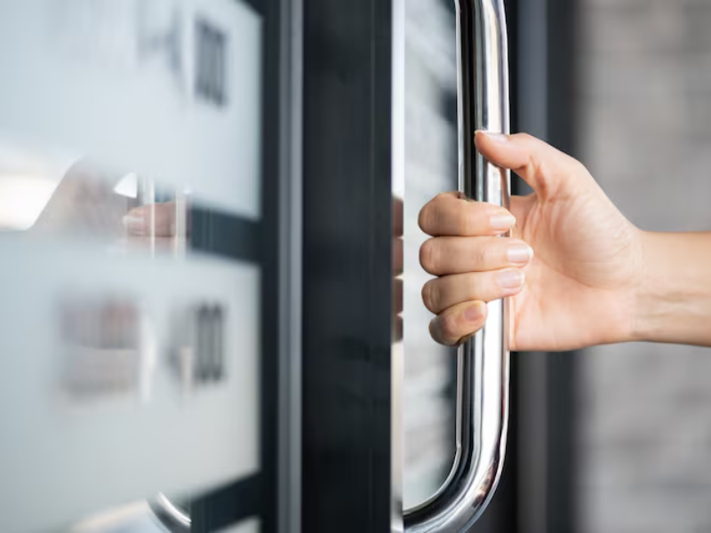 Smart automatic silent door opener integrated into a modern office boardroom