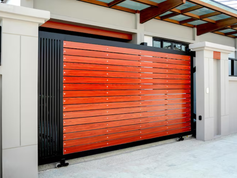 Industrial sliding gate motor operating secure sliding gates at a large logistics and distribution center.