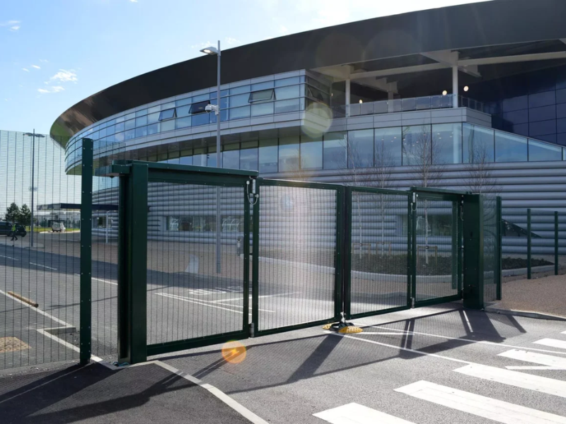 Close-up of industrial sliding gate motor installed on secure sliding gates at a logistics warehouse