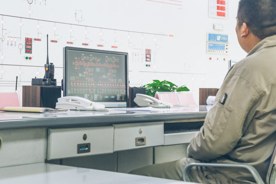 workers in control room of a factory - Alarm Escalation
