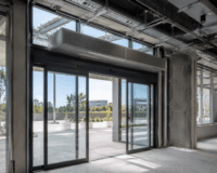 Automatic Sliding Door HVAC Integration: Coordinating Doors with Overhead Air Curtains