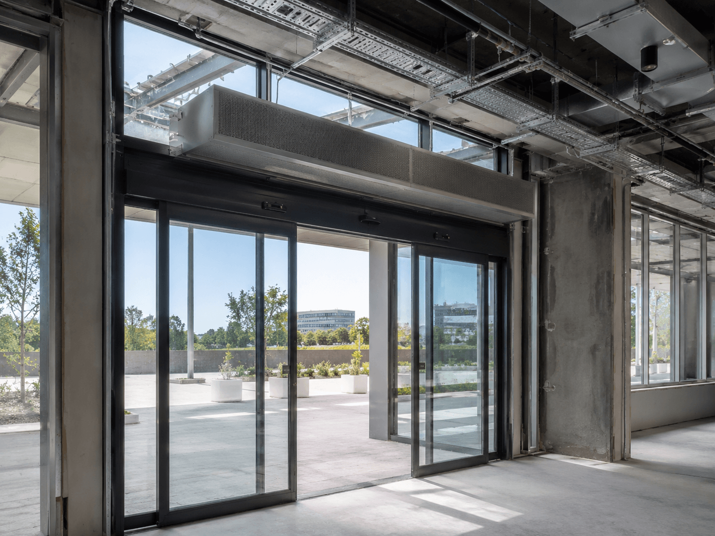 Automatic Sliding Door HVAC Integration: Coordinating Doors with Overhead Air Curtains